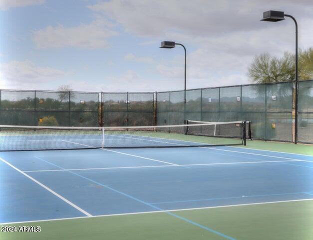 view of sport court with fence