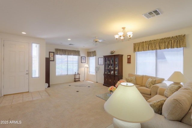 living room featuring recessed lighting, visible vents, light colored carpet, and light tile patterned floors