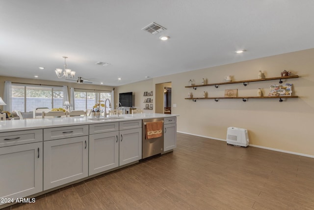 kitchen with sink, dishwasher, hanging light fixtures, light hardwood / wood-style floors, and gray cabinets