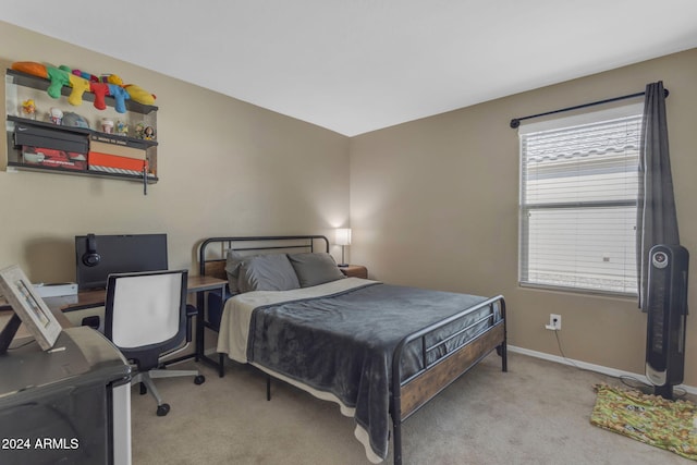 bedroom featuring light carpet