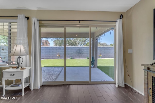 doorway with hardwood / wood-style floors