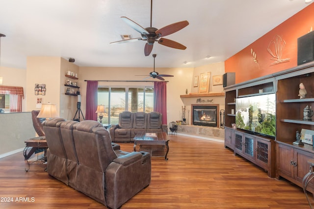 living room featuring hardwood / wood-style flooring and ceiling fan