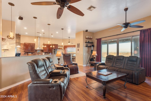 living room featuring dark hardwood / wood-style floors and ceiling fan