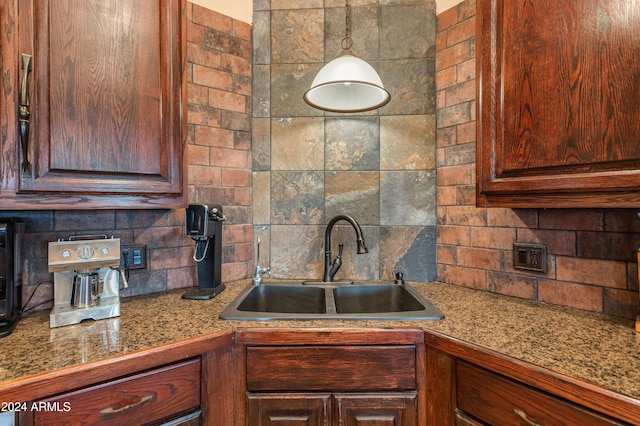 kitchen featuring backsplash and sink