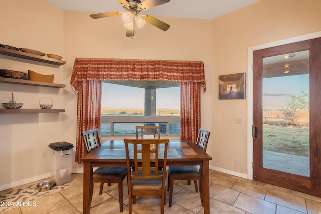 dining room with ceiling fan and light tile patterned flooring