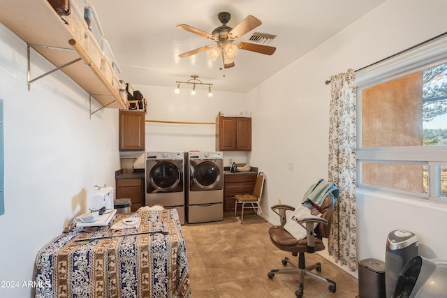 clothes washing area featuring washer and clothes dryer, ceiling fan, cabinets, and sink