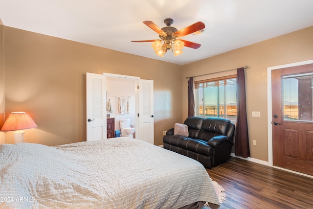 bedroom featuring connected bathroom, dark hardwood / wood-style floors, and ceiling fan