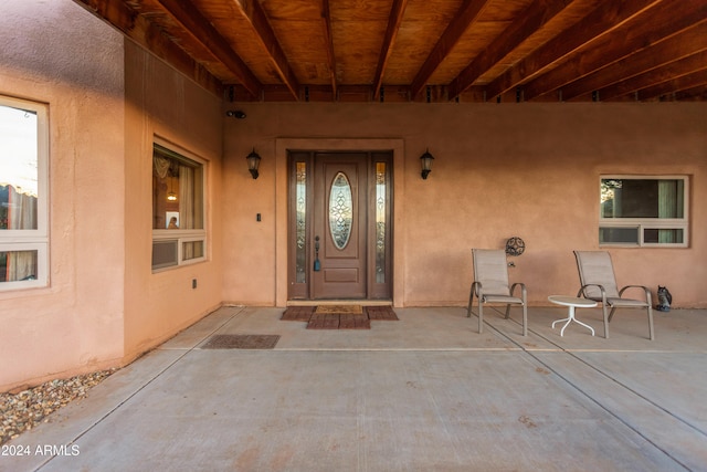 entrance to property featuring covered porch