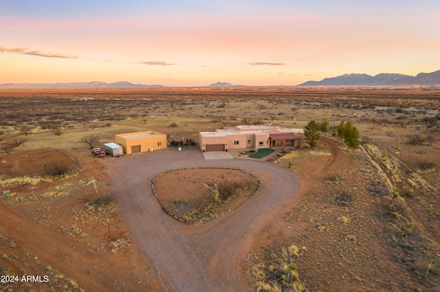 aerial view at dusk with a mountain view