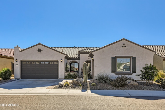 25979 W Taro Dr, Buckeye, AZ 85396 - mediterranean / spanish house featuring a garage, stucco siding, and a tile roof