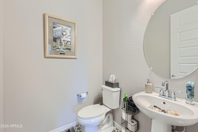 25979 W Taro Dr, Buckeye, AZ 85396 - bathroom featuring a sink and baseboards