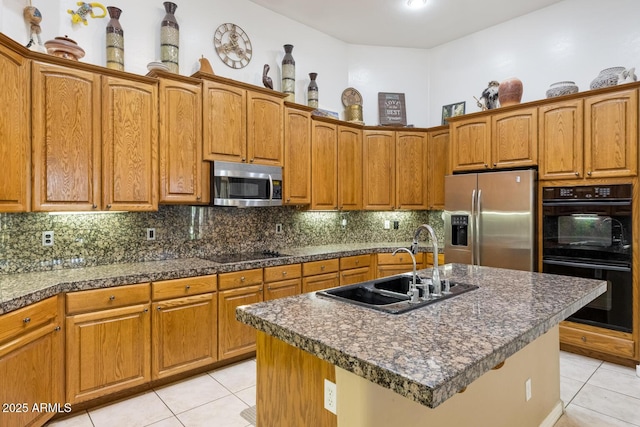 8167 E Sand Flower Dr, Scottsdale, AZ 85266 - kitchen with black appliances, a sink, light tile patterned floors, backsplash, and brown cabinets