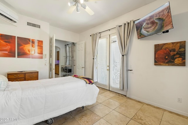 8167 E Sand Flower Dr, Scottsdale, AZ 85266 - bedroom featuring a wall mounted air conditioner, light tile patterned flooring, access to exterior, ceiling fan, and baseboards
