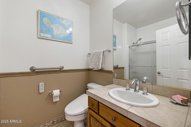 8167 E Sand Flower Dr, Scottsdale, AZ 85266 - bathroom featuring a shower with shower door, toilet, vanity, and tile patterned floors
