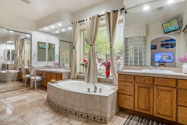 8167 E Sand Flower Dr, Scottsdale, AZ 85266 - full bathroom featuring a bath, tile patterned floors, two vanities, and recessed lighting
