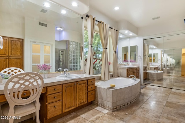 8167 E Sand Flower Dr, Scottsdale, AZ 85266 - full bath featuring a garden tub, two vanities, a shower stall, recessed lighting, and tile patterned floors