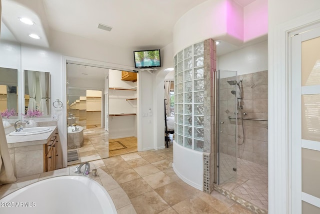 8167 E Sand Flower Dr, Scottsdale, AZ 85266 - bathroom featuring a shower stall, vanity, a garden tub, a spacious closet, and recessed lighting