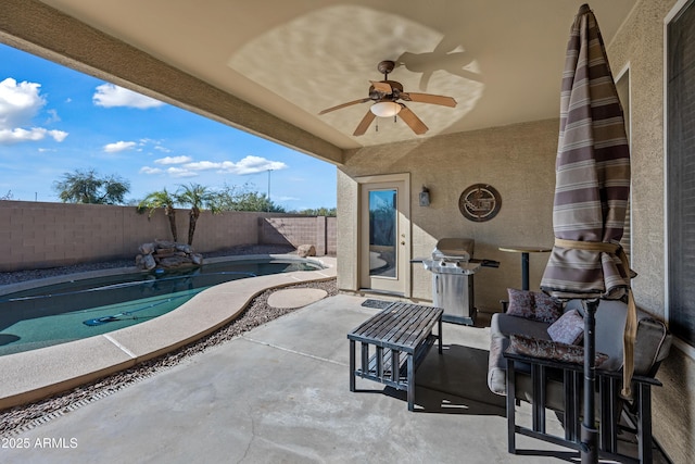 view of patio / terrace featuring a fenced in pool and grilling area