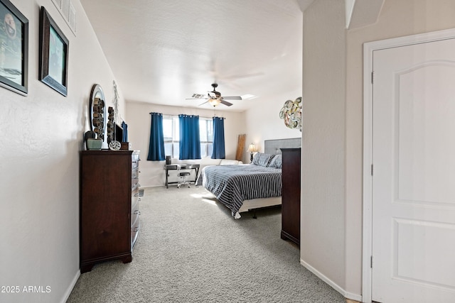 bedroom with ceiling fan and carpet flooring