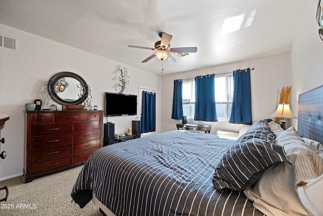 bedroom featuring light carpet and ceiling fan