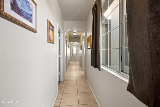 hallway featuring light tile patterned floors