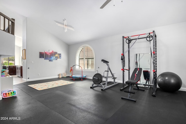 workout room with vaulted ceiling