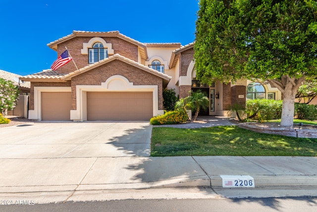 mediterranean / spanish-style home featuring a garage