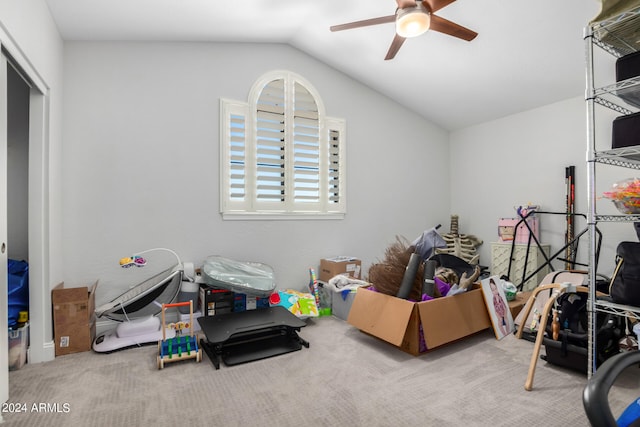 rec room featuring carpet floors, ceiling fan, and lofted ceiling