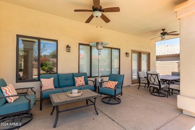 view of patio featuring an outdoor living space and ceiling fan