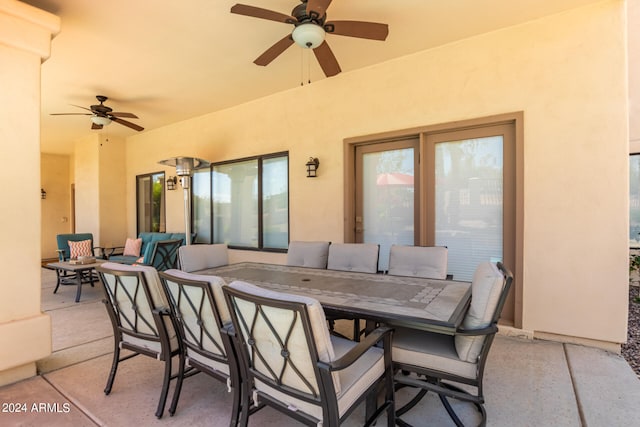 view of patio / terrace with an outdoor living space and ceiling fan