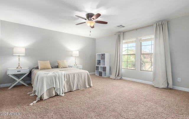 bedroom with visible vents, baseboards, carpet, and ceiling fan