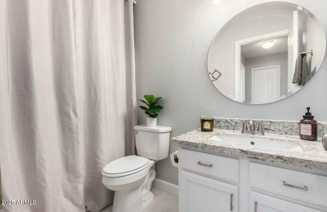 full bathroom featuring toilet and vanity