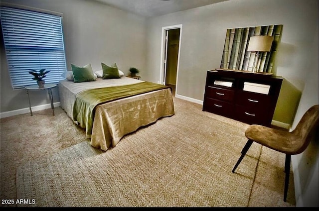 bedroom featuring baseboards and carpet floors