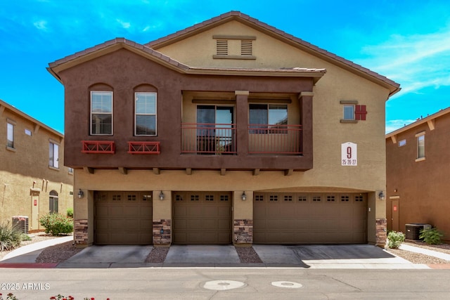 2250 E Deer Valley Rd Unit 26, Phoenix, AZ 85024 - view of front of house with an attached garage and stucco siding