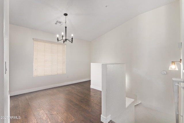 2250 E Deer Valley Rd Unit 26, Phoenix, AZ 85024 - unfurnished room with a chandelier, wood finished floors, baseboards, and lofted ceiling