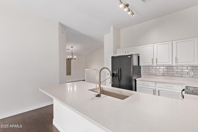 2250 E Deer Valley Rd Unit 26, Phoenix, AZ 85024 - kitchen with a sink, black fridge with ice dispenser, tasteful backsplash, white cabinets, and dark wood-style flooring