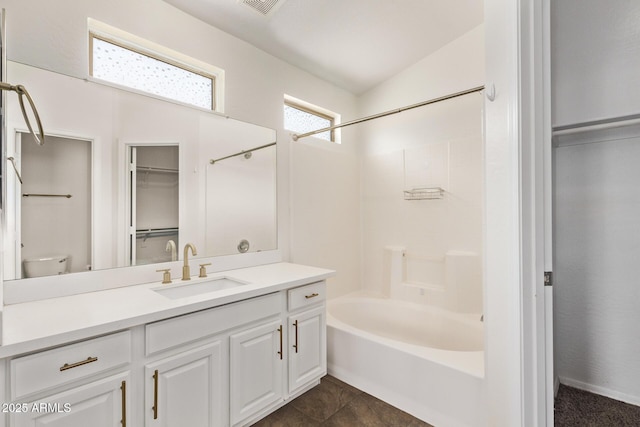 2250 E Deer Valley Rd Unit 26, Phoenix, AZ 85024 - full bathroom featuring vanity, bathing tub / shower combination, toilet, and a spacious closet