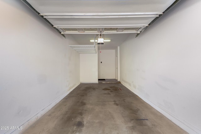 2250 E Deer Valley Rd Unit 26, Phoenix, AZ 85024 - garage featuring a garage door opener and baseboards