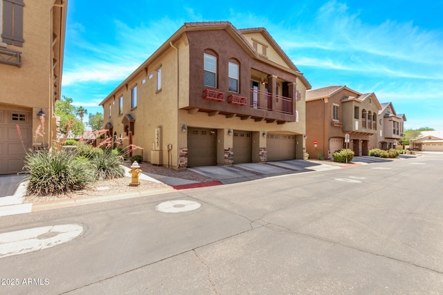 2250 E Deer Valley Rd Unit 26, Phoenix, AZ 85024 - view of building exterior featuring a garage and a residential view