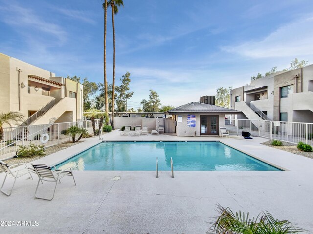 view of swimming pool featuring a patio area