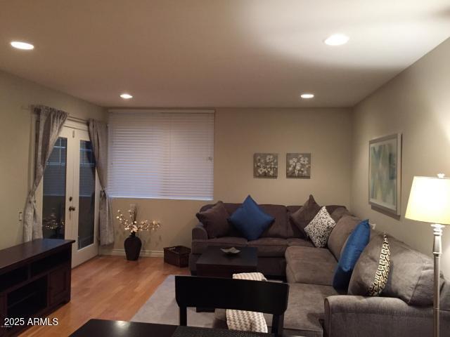 4120 N 78th St Unit 116, Scottsdale, AZ 85251 - living room with light wood finished floors, recessed lighting, baseboards, and french doors