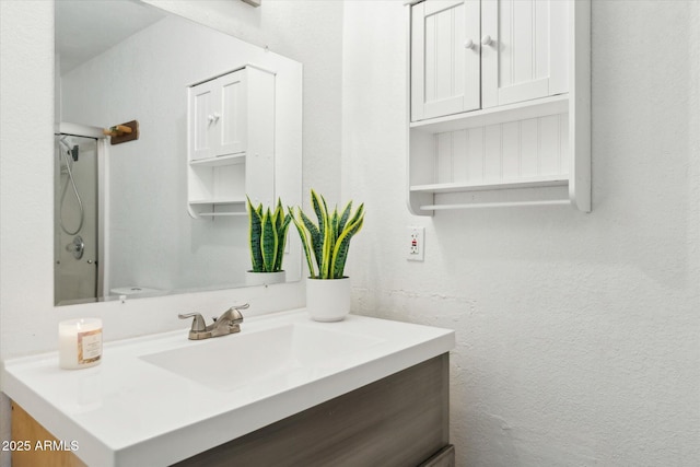 full bath with vanity and a shower