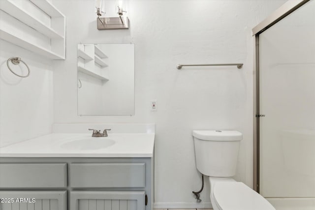 bathroom with toilet, vanity, and a shower