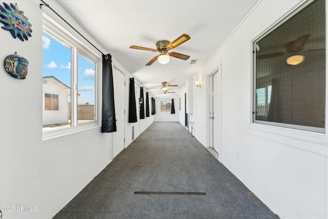 hall featuring carpet floors
