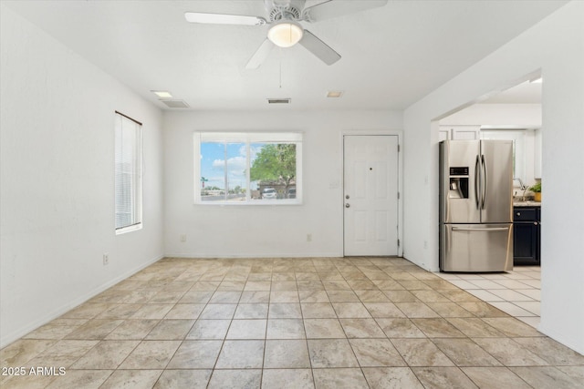 spare room with ceiling fan