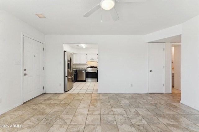 unfurnished living room featuring ceiling fan