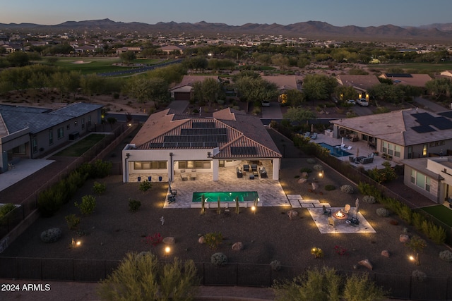 aerial view at dusk with a mountain view