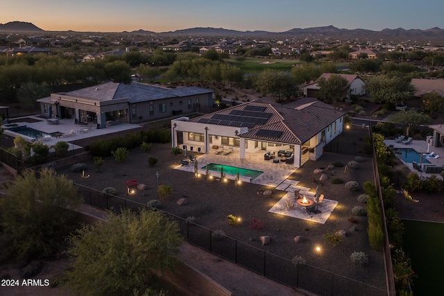 aerial view at dusk with a mountain view