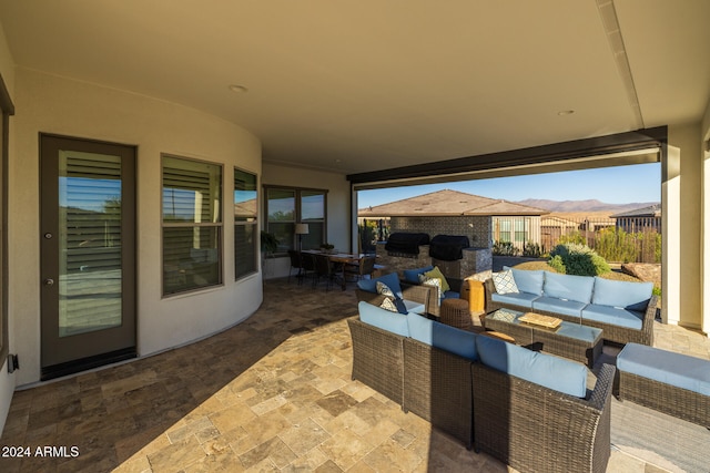 view of patio featuring outdoor lounge area and a mountain view