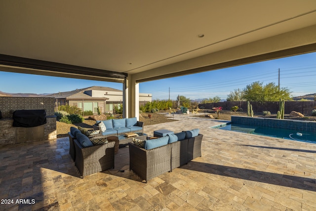 view of patio featuring outdoor lounge area, area for grilling, and a fenced in pool